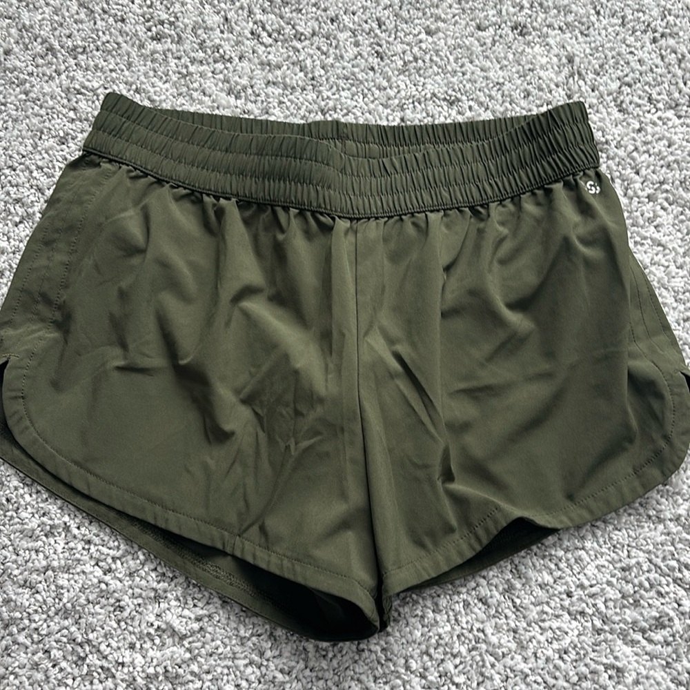 Green running shorts
